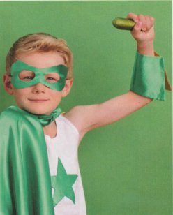 boy holding cucumber